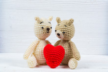 Couple Teddy Bear With Red Heart Crochet Knitting Handmade On White Wooden Table, Love And Valentine Concept.