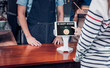 © weedezign - customer pay drink with bitcoins on tablet screen at cafe counter bar,seller coffee shop accept payment by crypto currency.digital money concept.