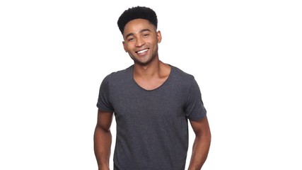 Poster - Happy african man in t-shirt showing thumb up at the camera over white background