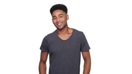 Poster - Happy african man in t-shirt showing peace gesture at the camera over white background
