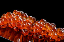 Salmon Roe Caviar Isolated On Black Background