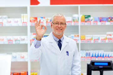 Sticker - senior apothecary at pharmacy showing ok hand sign