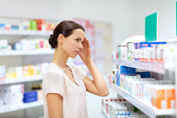 Sticker - customer with headache choosing drugs at pharmacy