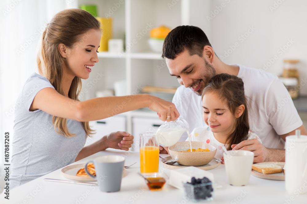 happy family having breakfast at home - obrazy, fototapety, plakaty 