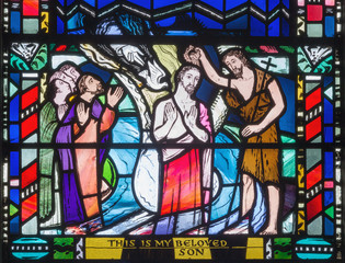 Wall Mural - LONDON, GREAT BRITAIN - SEPTEMBER 16, 2017: The Babtism of Jesus cene on the stained glass in church St Etheldreda by Charles Blakeman (1953 - 1953).