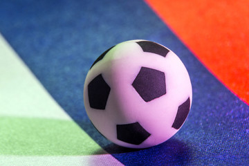 A symbol of football. A picture of a soccer ball on the flag of the Russian Federation. Macro. Close up. Sports concept.