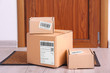 © Africa Studio - Parcel boxes on floor near door