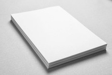 Blank Sheets Of Paper On Light Background. Mock Up For Design