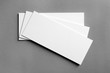 © Africa Studio - Blank cards on grey background. Mock up for design