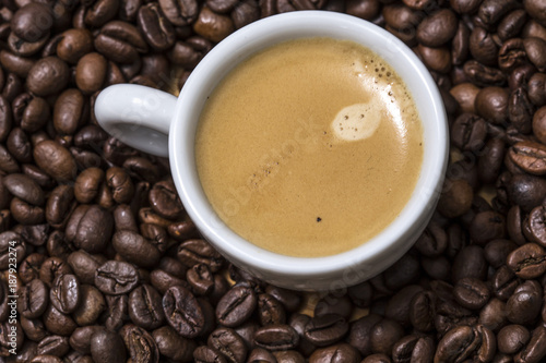 Espresso Creamy Coffee On A White Cup Over Many Brown Espresso Creamy Coffee On A White Cup Over Many Brown