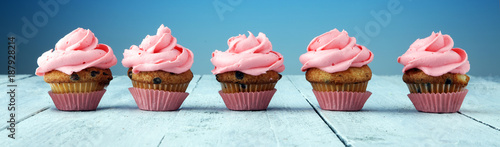 Fotografía Tasty cupcakes on wooden background