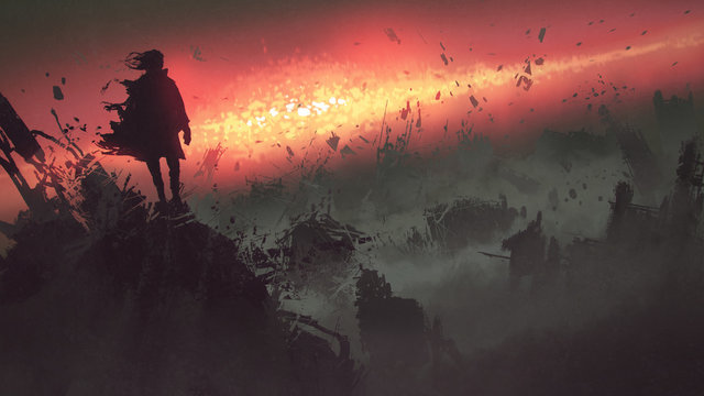 end of the world concept of the man on ruined buildings looking at apocalyptic explosion on the eart