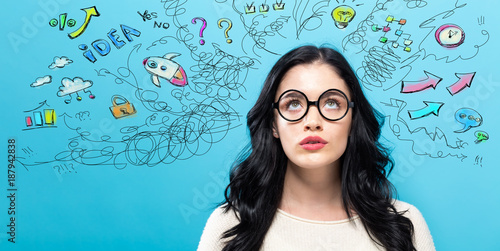 Young woman with many thoughts on a blue background Slika na platnu