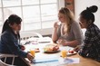 © Wavebreak Media - Female executives having breakfast in the creative office