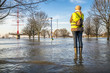 Lady standing in flooded street