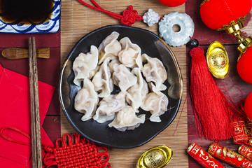 Wall Mural - Chinese Jiaozi new year food, spring festival food on traditional spring festival Spring festival atmosphere and dumplings