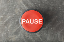 Overhead Of Red Pause Push Button On Concrete Background