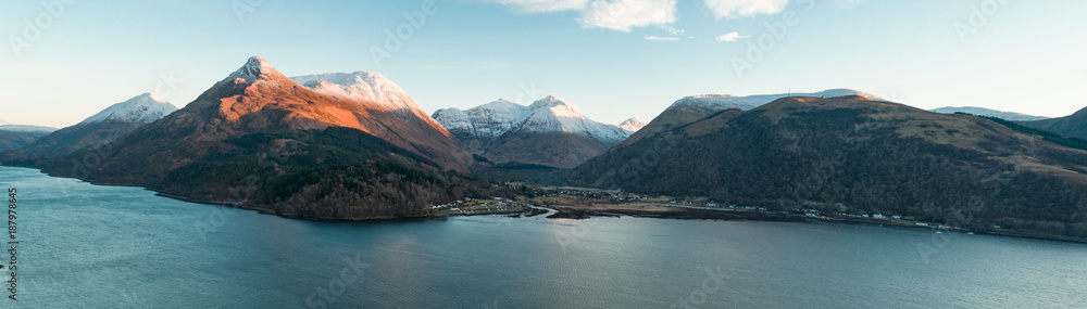 Aerial View of Glencoe and the Mountains Surrounding The Small Town in Scotland - obrazy, fototapety, plakaty 