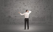 © ra2 studio - Salesman with business charts on wall