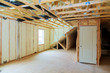 Heat isolation in new prefabricated house with mineral wool and wood.