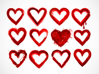 Set of red grunge hearts on white background.