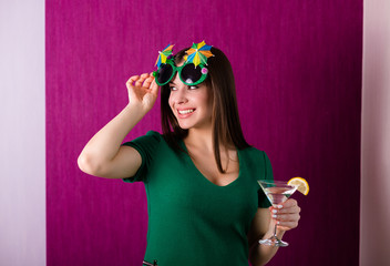 Woman wearing party glasses celebrates St. Patrick's Day