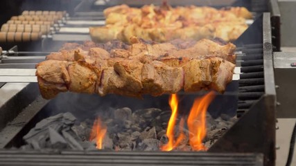 Sticker - Barbecue meat grilling on charcoal. Tasty grilled meat. Cooking shish kebab on metal skewers. Roasted meat with crust. Cooking shashlik on barbeque grill