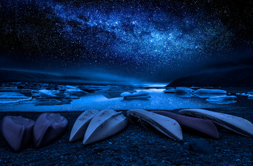 Wall Mural - milky way, kayaks and the glacier lake at night, iceland