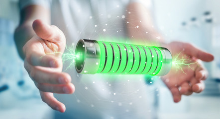 Poster - Businessman using green battery with lightnings 3D rendering