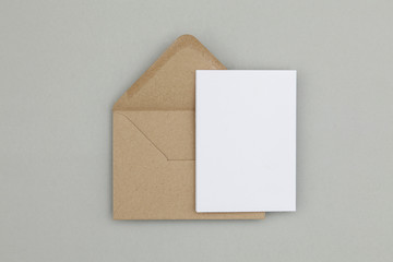 Wall Mural - Blank white card with kraft brown paper envelope template mock up