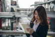 © SP56 - Portraits of beautiful asian woman look confidence is standing and writing a note while working.