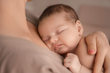 Poster - Young mother with cute baby at home