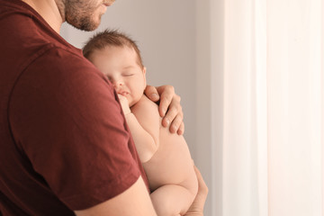 Wall Mural - Father with cute little baby at home