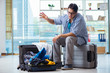 © Elnur - Young man preparing for vacation travel