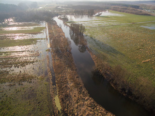 Wall Mural - Aerial view of a river with flooding - flooded meadows and fields in germany