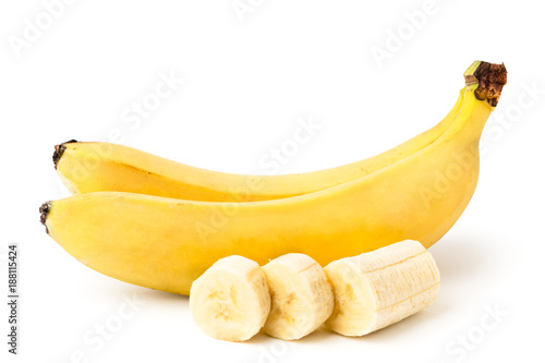 Fotografía Two ripe bananas, and cut a piece of peeled banana on a white, isolated