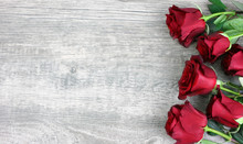 Beautiful Red Roses Still Life Over Rustic Wooden Background, Love Concept, Shot From Above
