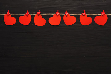 Wall Mural - Valentine day background, paper hearts border on wood, copy space