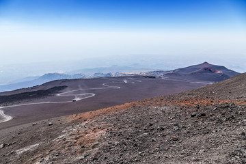  The volcano of Etna, Sicily, Italy. Bus-cross-country vehicles with tourists on serpentine