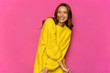 Charming beautiful girl , smiling widely, waiting for Valentine's day. Dressed in yellow sweater. On pink background.