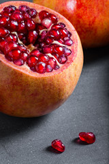 Poster - Sliced pomegranate with juicy red grains