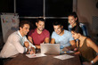 © Africa Studio - Group of young professionals having late night meeting in office