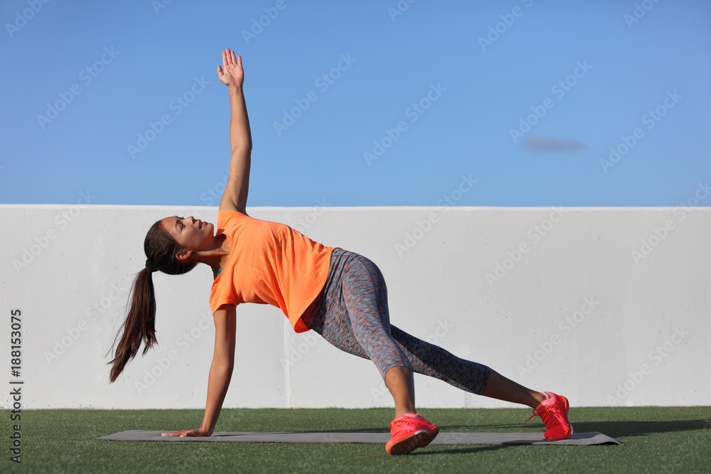 Yoga pose variation fitness girl doing the fallen triangle assited with ...