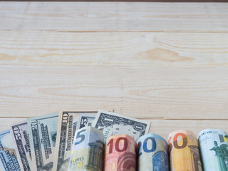 euro and dollar currency on wood table