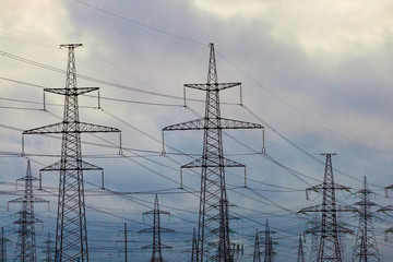 High voltage power lines against the background of the evening sky.