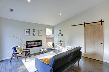 Wall Mural - Sun filled family room in soft beige tones.