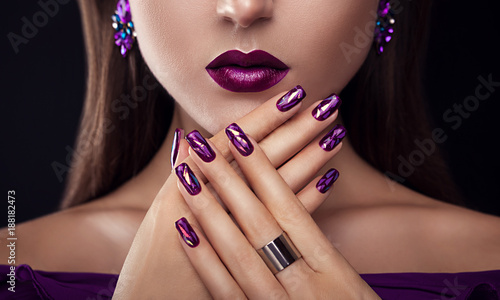 Vászonkép Beautiful woman with perfect make-up and manicure wearing jewellery