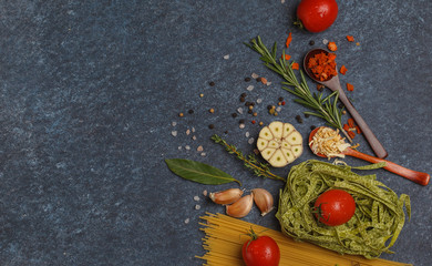 Wall Mural - Selection of spices, pasta,  herbs and greens. Ingredients for cooking pasta. Dark background, top view, copy space.