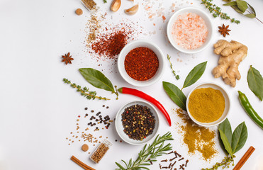 Selection of spices herbs and greens. Ingredients for cooking. White background, top view, copy space.