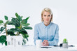 © LIGHTFIELD STUDIOS - portrait of confident real estate agent sitting at workplace